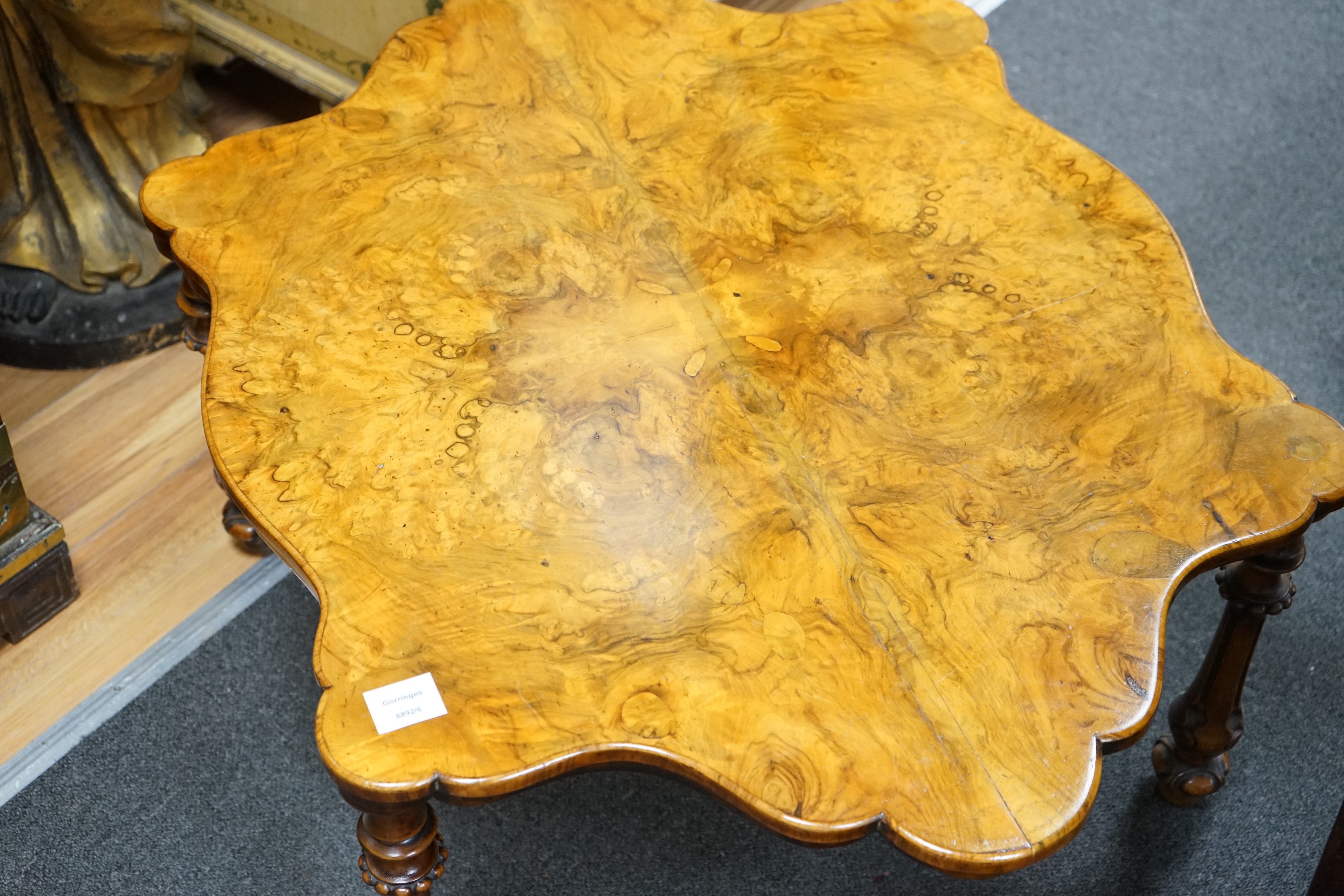 A Victorian burr walnut quarter veneered occasional table, width 93cm depth 70cm height 38cm